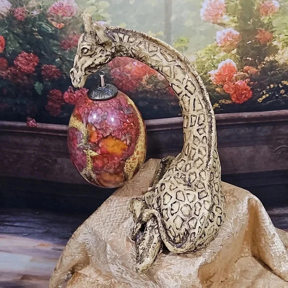 Giraffe holding an Ornament - Picture 9 of 13